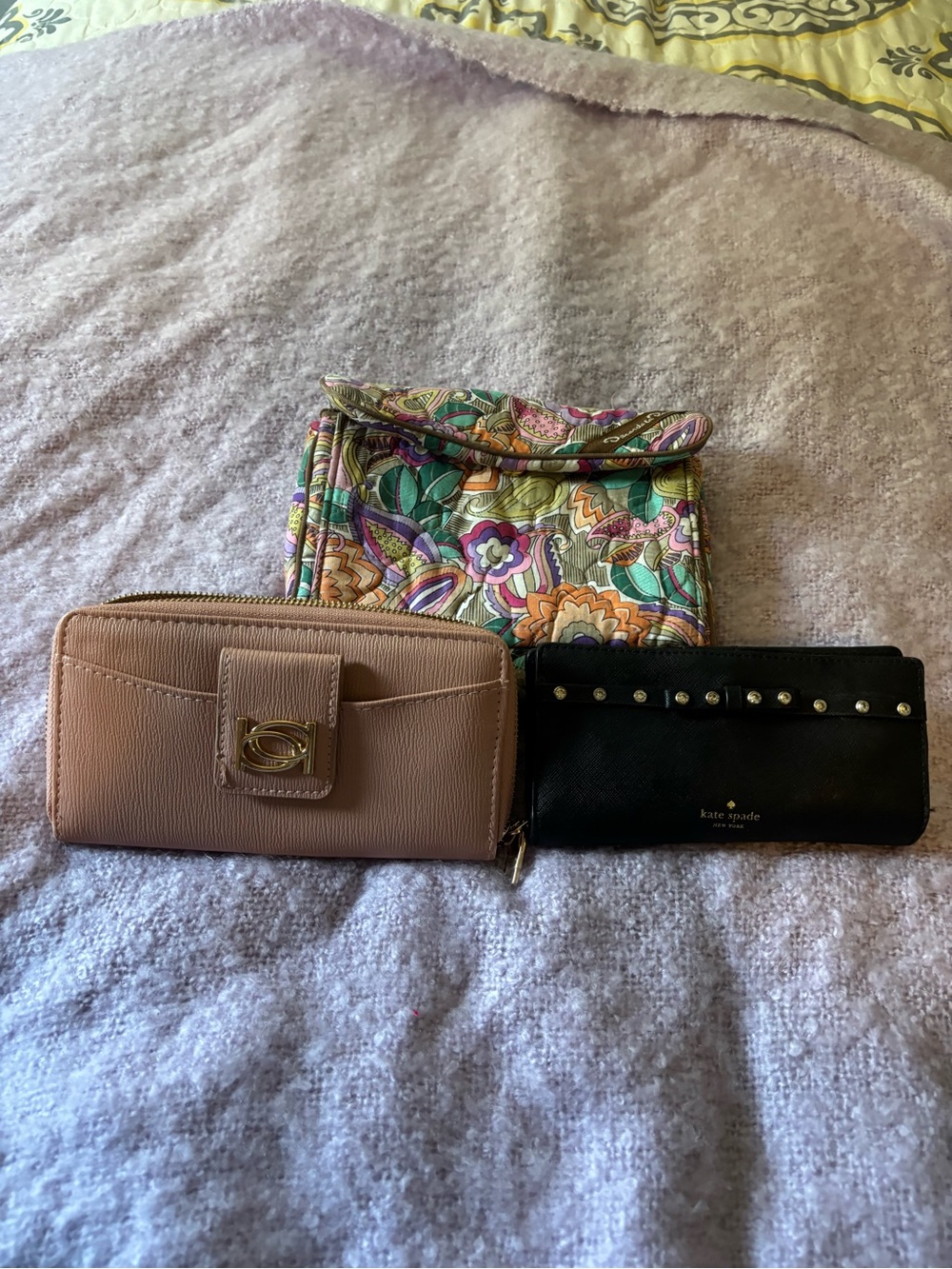 Bundle of wallets and cosmetic bag
